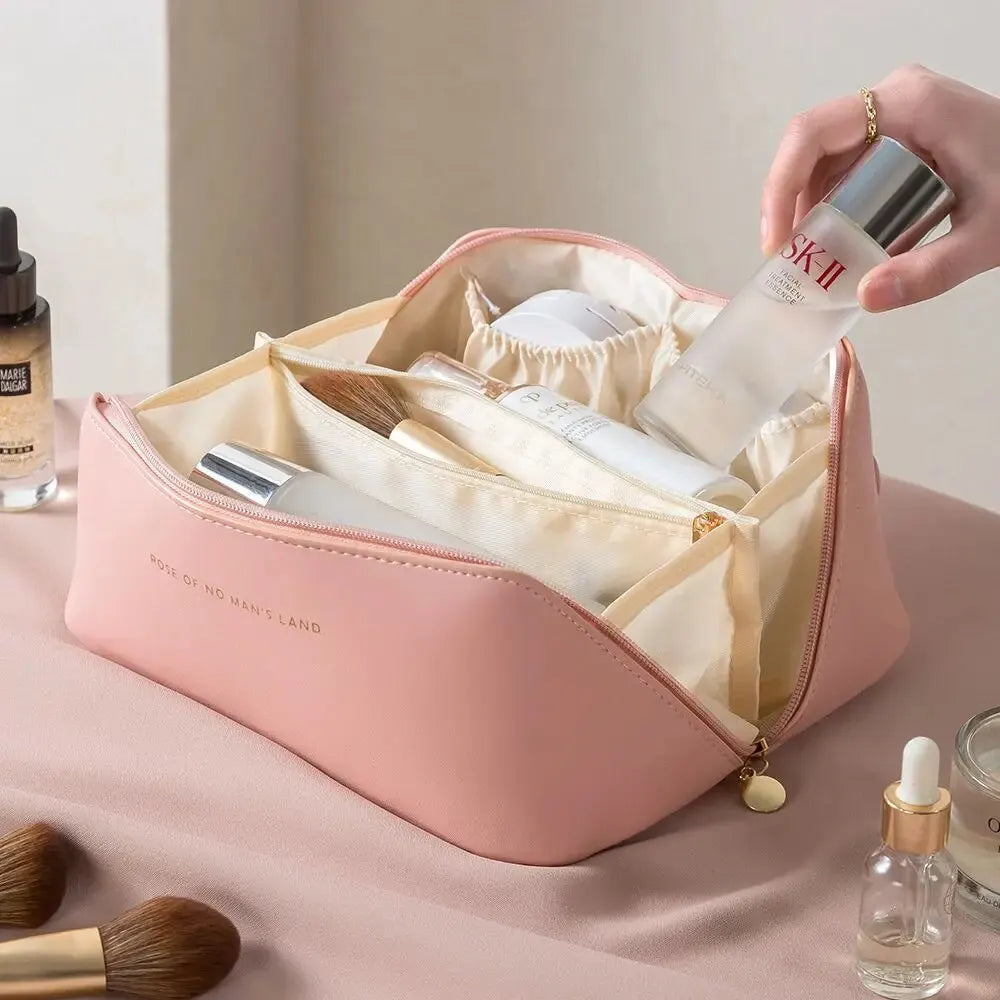 Pink zippered travel toiletry bag shown open
