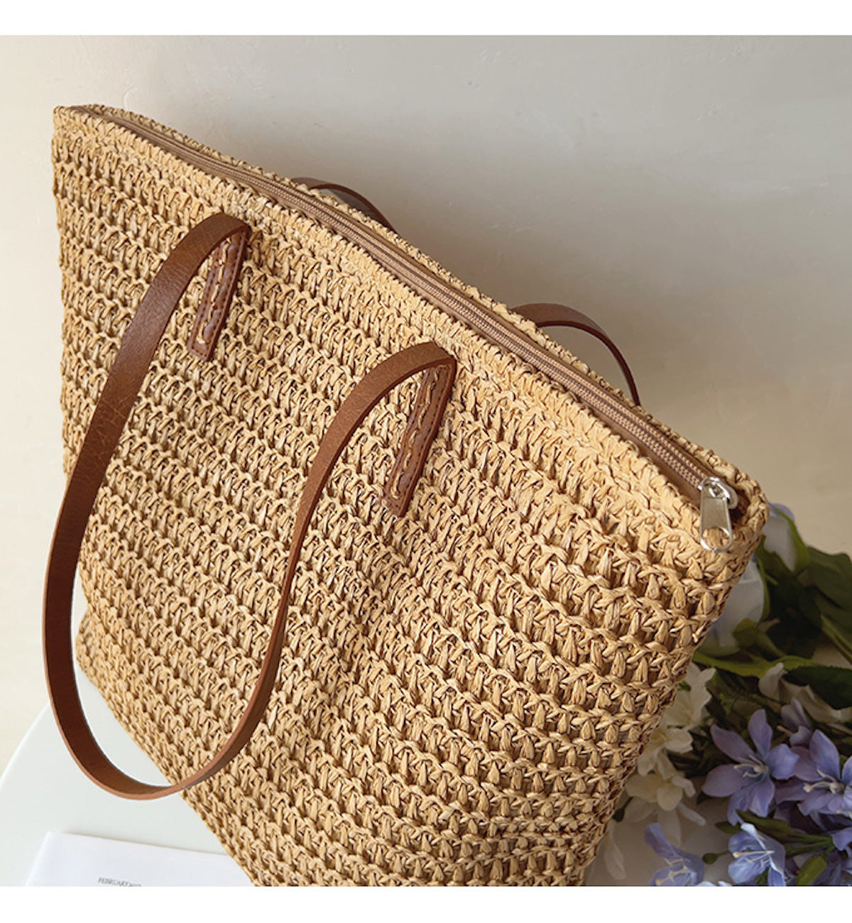 Angled view of the Brown woven tote bag