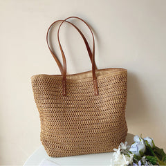 Brown woven tote bag displayed upright