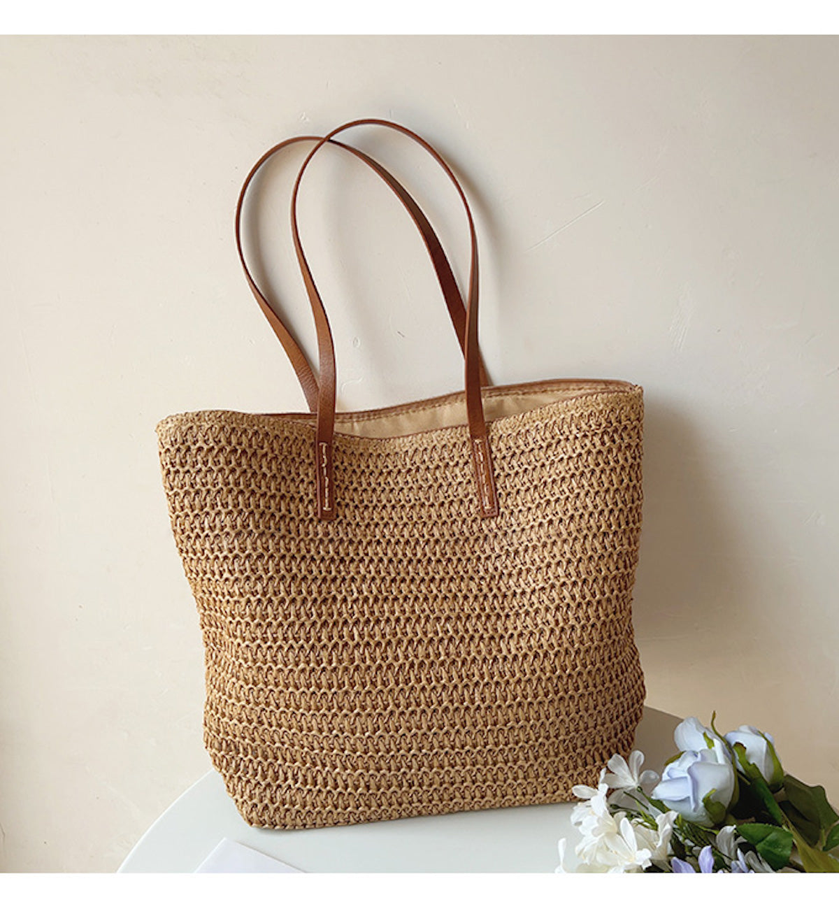 Brown woven tote bag displayed upright