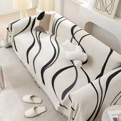 Reverse side of the Gray curved-line sofa throw