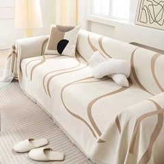 Khaki reversible chenille-cotton throw on a sofa