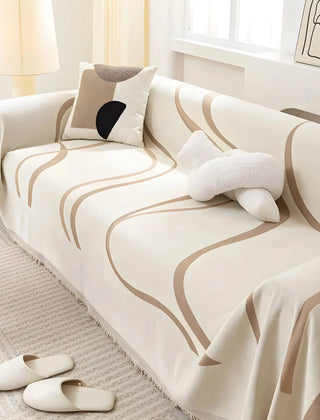 Khaki reversible chenille-cotton throw on a sofa
