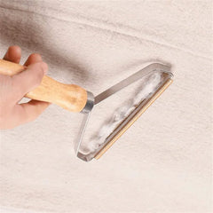 Portable lint remover used on a light blanket