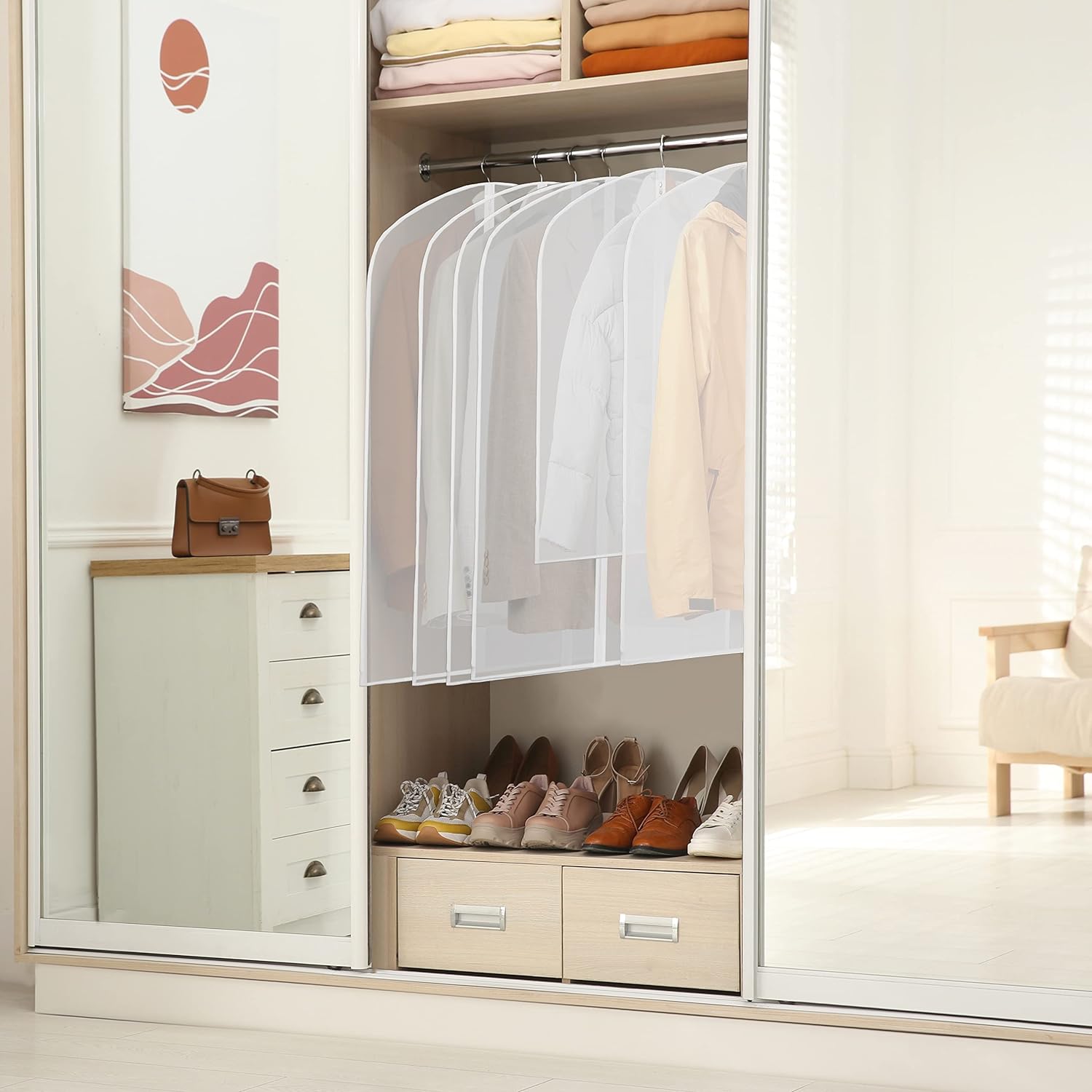 Garment covers hanging inside a wardrobe