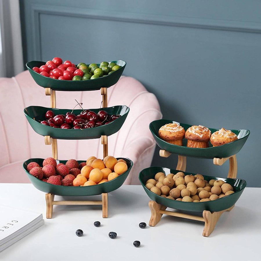Green and Beige tiered fruit stands on a table