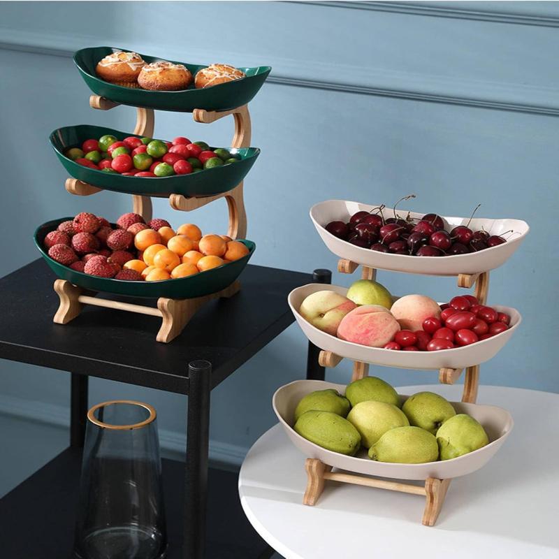 Green and Beige tiered fruit stands with fruit and bread