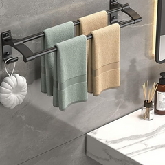 Three-bar towel rack installed beside a bathroom vanity