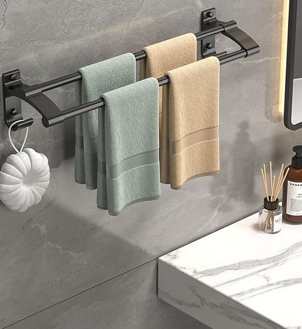 Three-bar towel rack installed beside a bathroom vanity