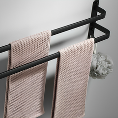Two-bar towel rack holding two towels