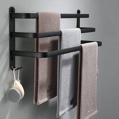 Three-bar wall-mounted towel rack with towels and end hooks