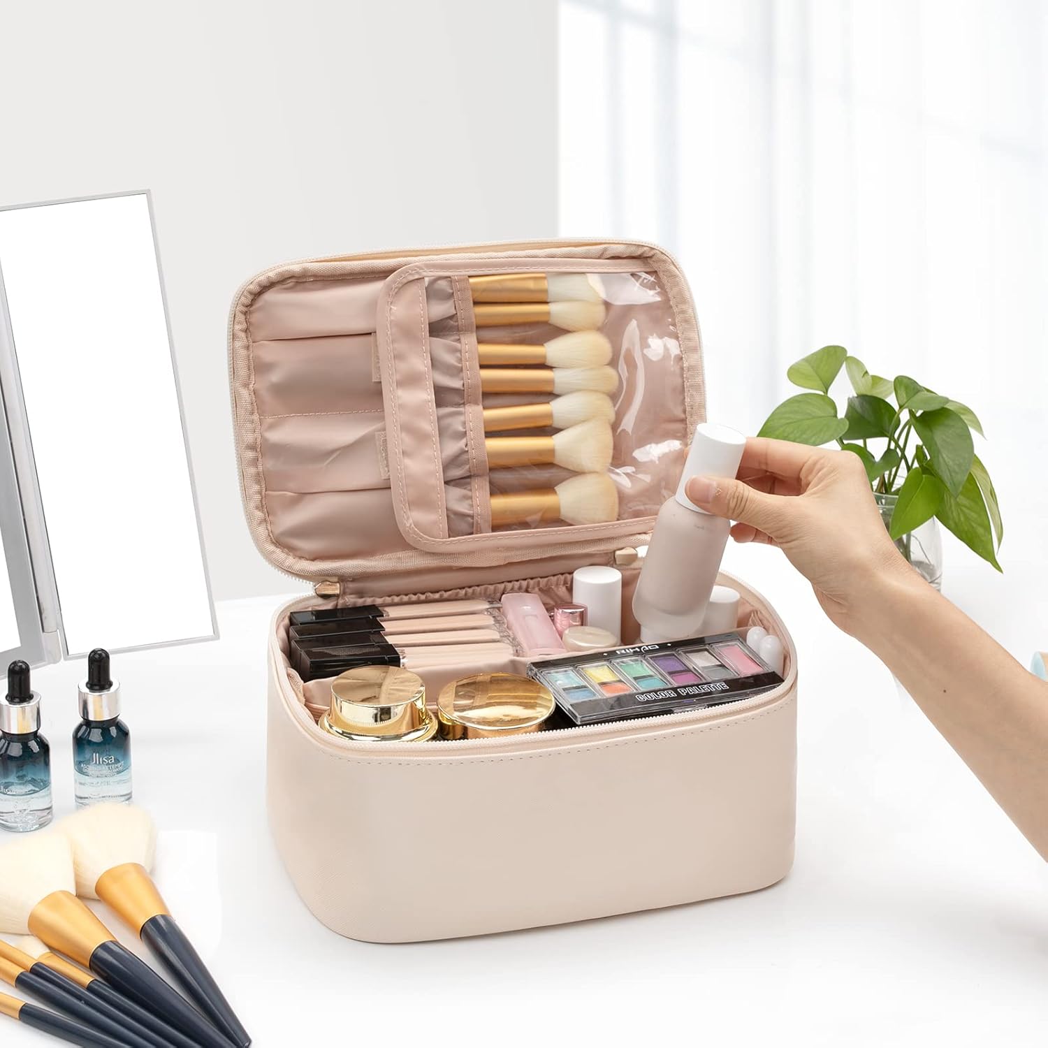 Beige makeup organizer in use beside a mirror
