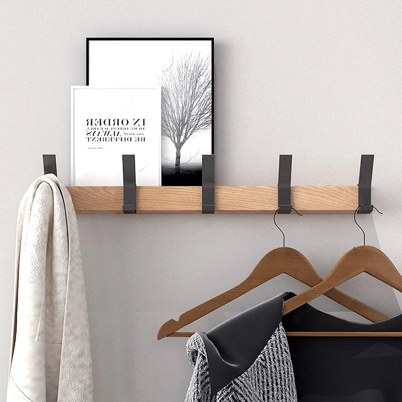 Wall coat rack holding clothes and hangers