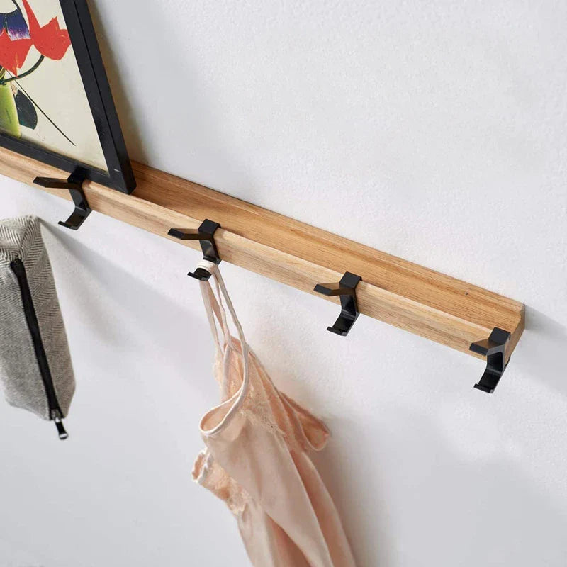 Wood wall coat rack with five black movable hooks